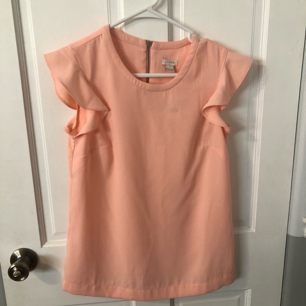 NWT J Crew women’s size 00 peach short sleeve top with a zipper in the back.